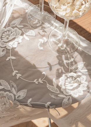 a glass of wine sitting on top of a table