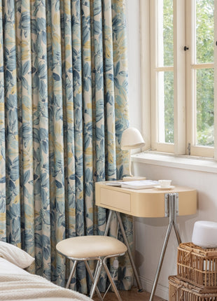 a bedroom with a bed, desk and window