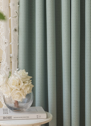 a vase with flowers on top of a table