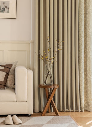 a living room with a white couch and a window