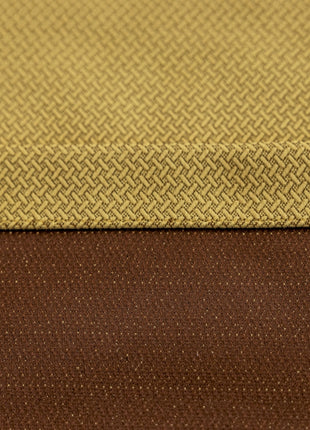 a close up of a brown and yellow fabric