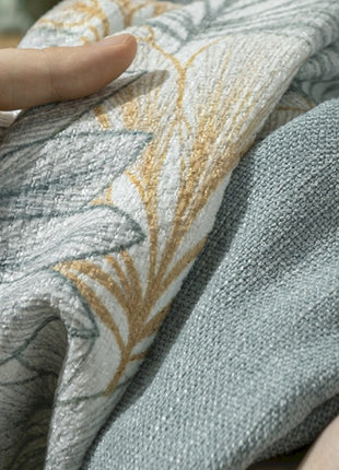 a person holding a piece of fabric in their hand