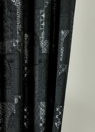 a black and white photo of a curtain