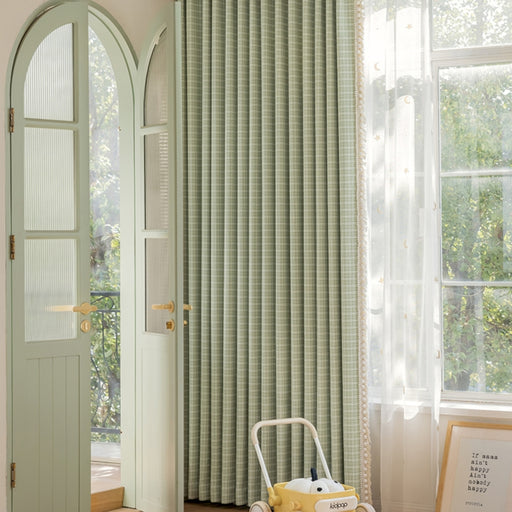 a suitcase sitting in front of a green door