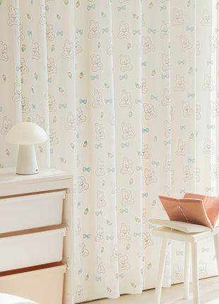 a room with a window and a white dresser