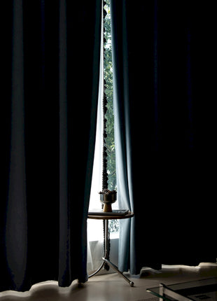 a living room with a couch and a window