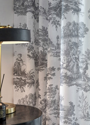 a lamp sitting on top of a table next to a window