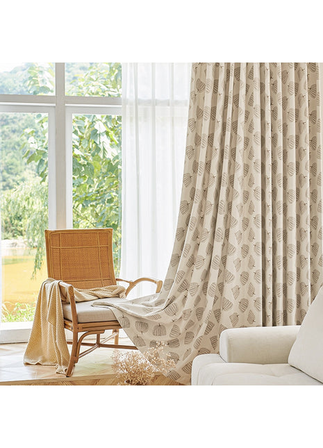 a living room with a chair and a window