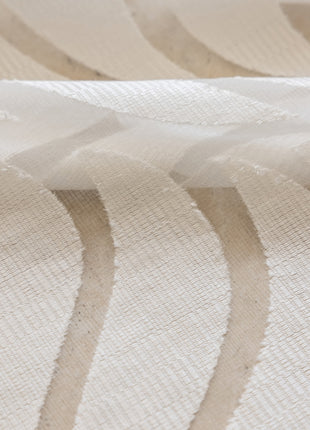 a close up of a white fabric with wavy lines