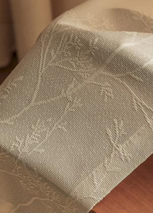 a close up of a bed with a wooden headboard