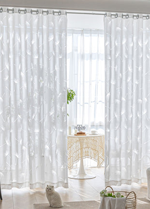 a living room with a cat sitting on the floor