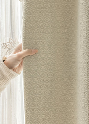 a person holding a curtain with their hand
