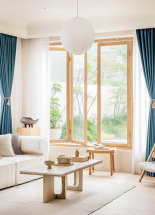 a living room filled with furniture and a large window