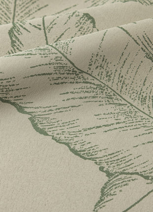 a close up of a fabric with a leaf pattern