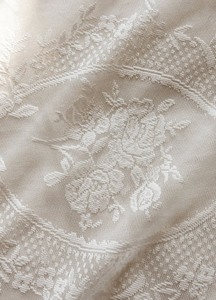 a close up of a white cloth with a design on it
