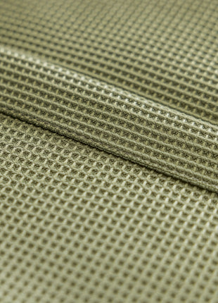 a close up view of a green fabric