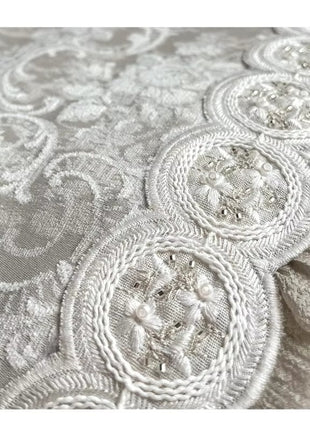 a close up view of a white lace