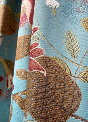 a close up of a curtain with a flower pattern