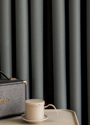 a suitcase sitting on top of a table next to a cup of coffee