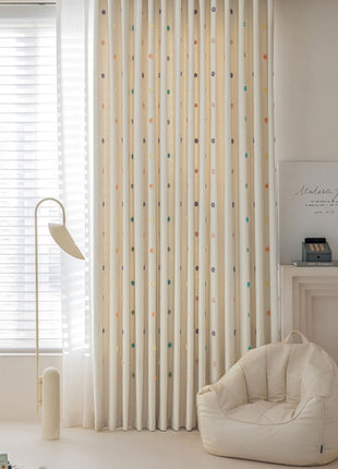 a living room with a chair and a window