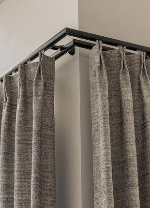 a close up of a curtain with a metal rod