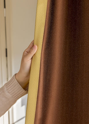 a woman is holding a curtain in her hand