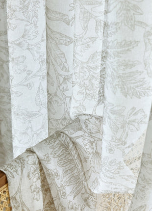 a close up of a window with a curtain