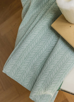 a laptop computer sitting on top of a wooden floor