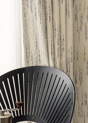 a close up of a chair near a window