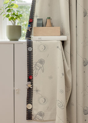 a white cabinet sitting next to a window