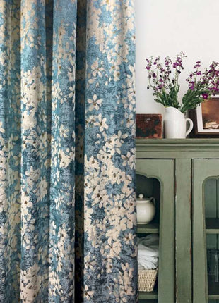 a green cabinet with a vase of flowers on top of it