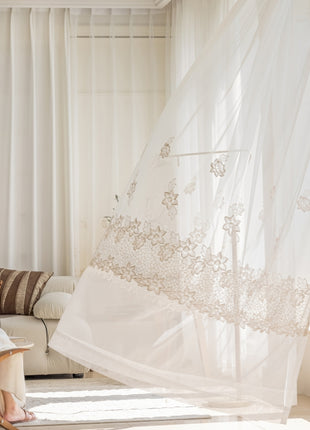 a woman sitting on a couch in a living room