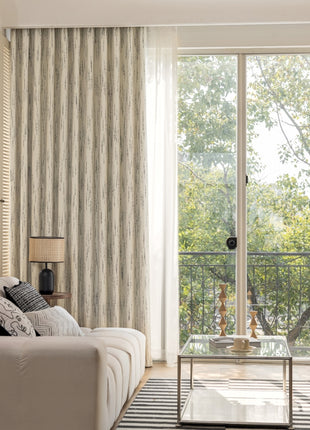 a living room filled with furniture and a large window