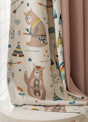 a blanket with a bear pattern on it