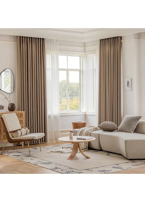 a living room filled with furniture and a large window