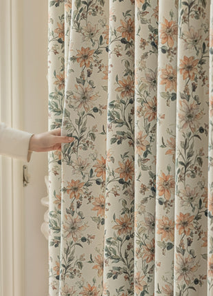 a person opening a curtain with their hand