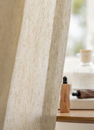 a bottle of lotion sitting next to a window