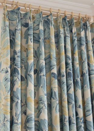 a curtain with a blue and yellow flower pattern