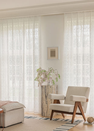a living room filled with furniture and a large window