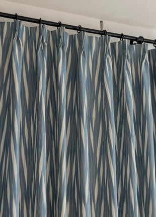 a close up of a curtain with a curtain rod