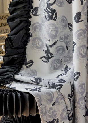 a close up of a curtain with a chair in the background