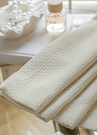 a close up of a chair with a table in the background