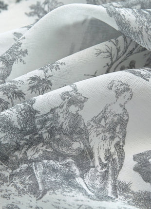 a close up of a bed sheet with a picture of animals on it