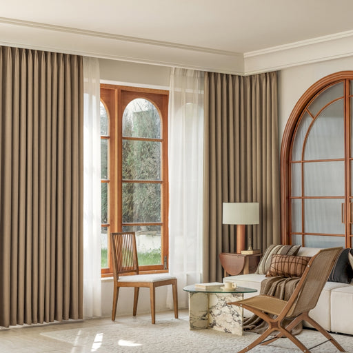 a living room filled with furniture and a large window