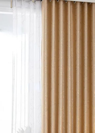 a living room with a large window covered in curtains