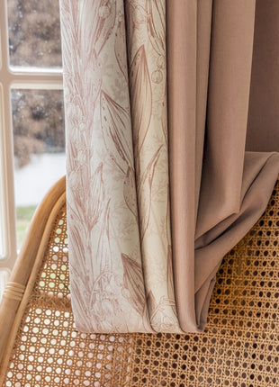 a wicker chair sitting next to a window