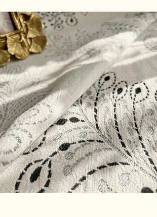 a close up of a fabric with a flower on it