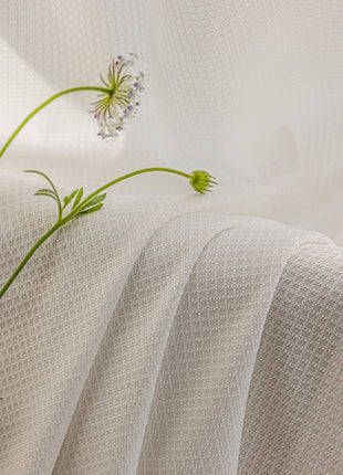 a vase filled with flowers sitting on top of a table