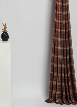 a window curtain with a pineapple on top of it