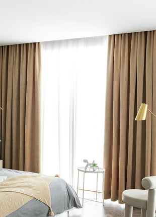 a bed room with a neatly made bed and a chair